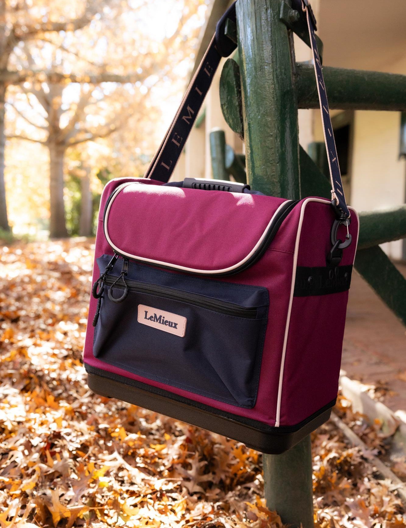 Front view of the Blackberry Elite Pro Grooming Bag hanging on a fence post outside
