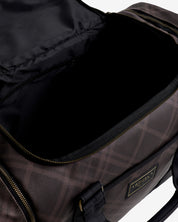Close-up view of the interior of the Cocoa LeMieux Heritage ProKit Lite Grooming Bag on a plain background