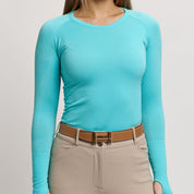 Front view of a female model wearing the Gem TKEQ Kennedy Seamless Long Sleeve Shirt 2.0 on a plain background