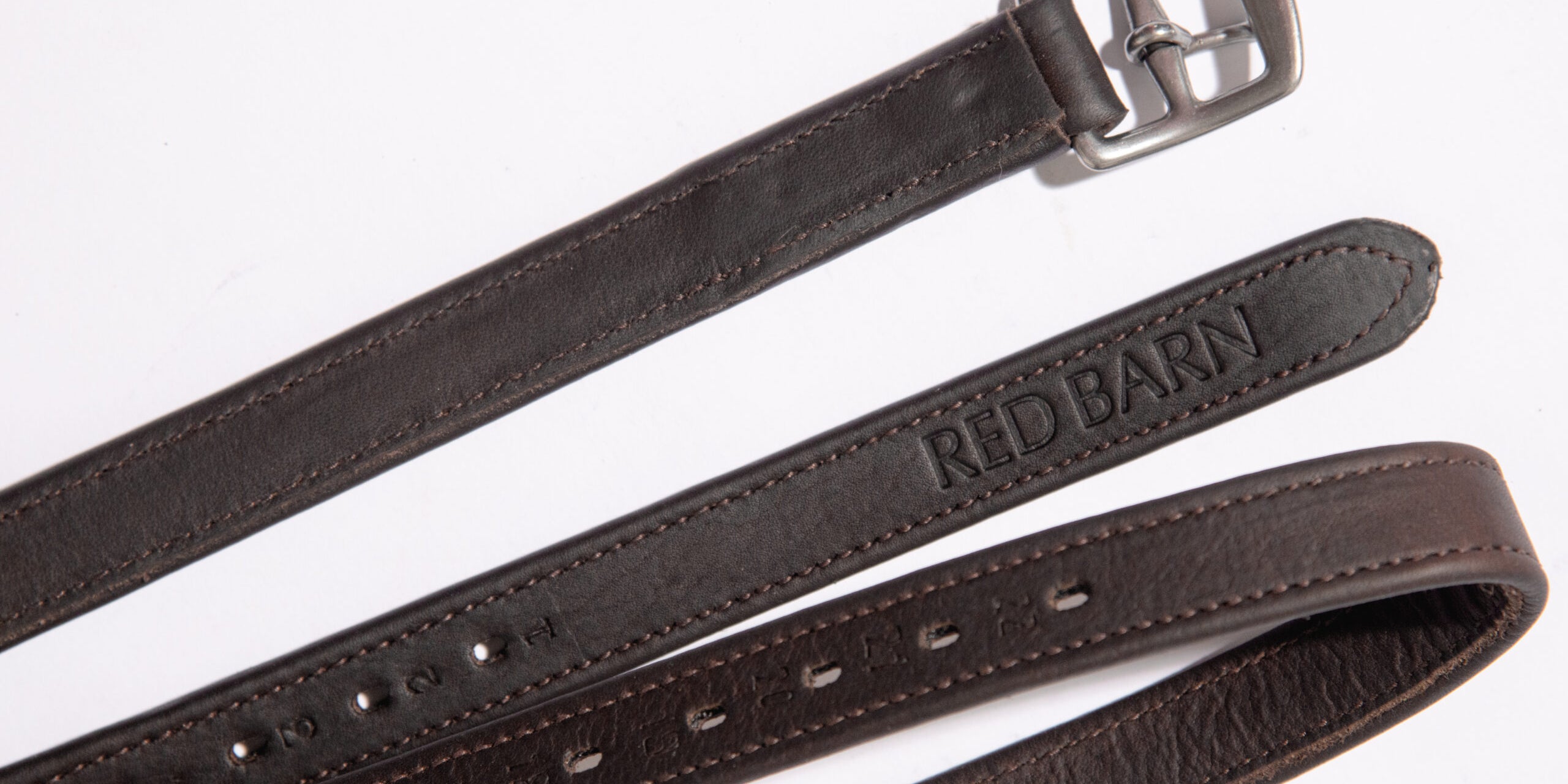 View of the brown Red Barn Geta' Grip Calf Lined Leathers on a plain background