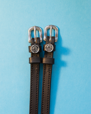 View of the Libra Mane Jane Spur Straps on a blue background