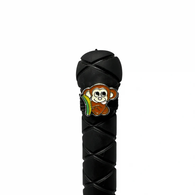 View of the Silly Monkey Dubois Cheval Crop Charm on the end of a crop on a white background