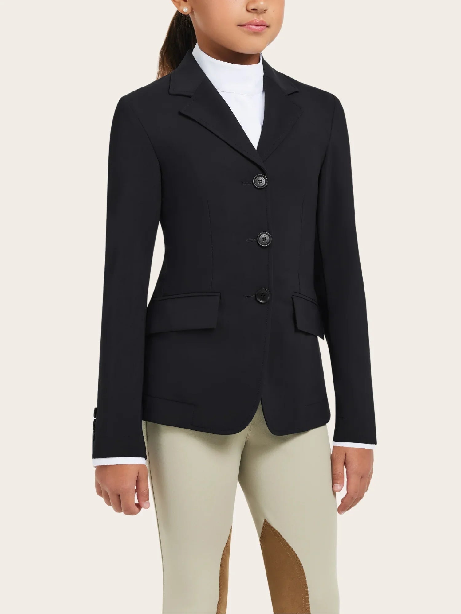 Close-up front view of a young female model wearing the black RJ Classics Kids Shore Show Coat on a plain background