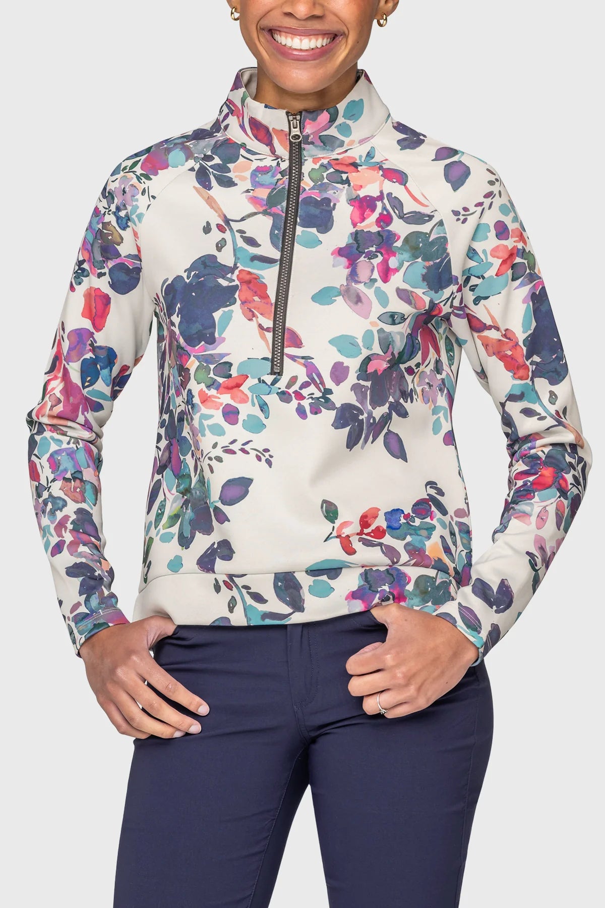 Front view of a model wearing the Kastel Amethyst Watercolor Floral Scuba 1/2 Zip Pullover on a plain background