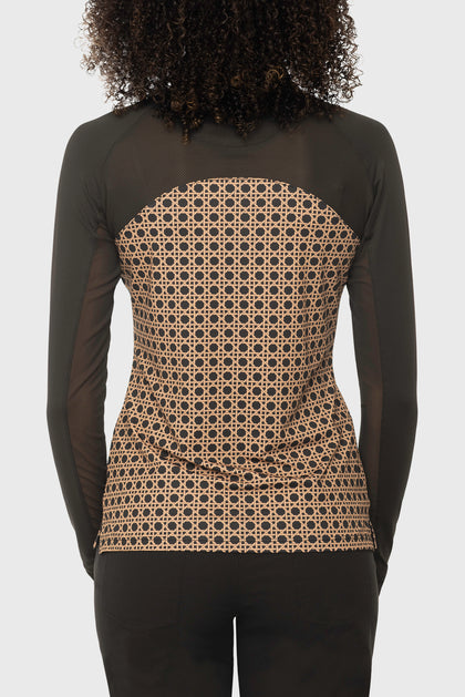Back view of a female model wearing the Kastel Camel Basketweave 1/4 Zip Long Sleeve Power Mesh Raglan Sun Shirt on a plain background