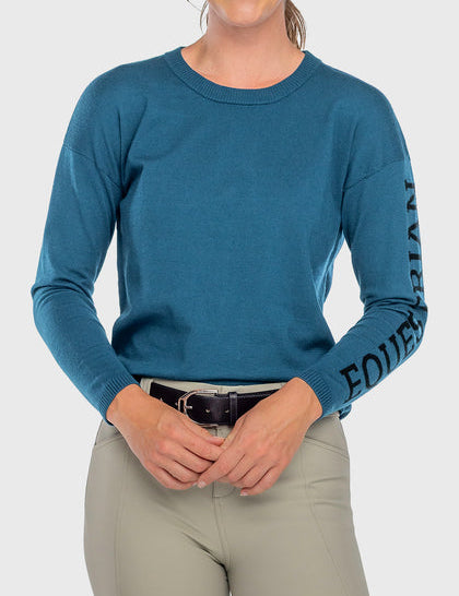 Front view of a female model wearing the Sailor Blue Kastel Crewneck Sweater on a plain background