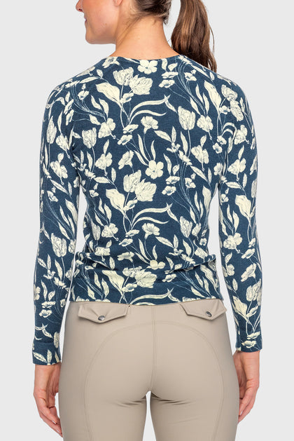 Back view of a female model wearing the Sailor Blue French Tulip Kastel Crewneck Sweater on a plain background