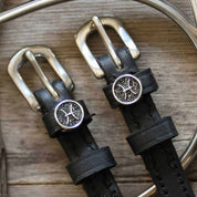 View of the Pisces Mane Jane Spur Straps on a wood background