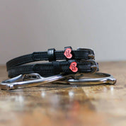 View of the Pony Love Mane Jane Spur Straps  on a wood table