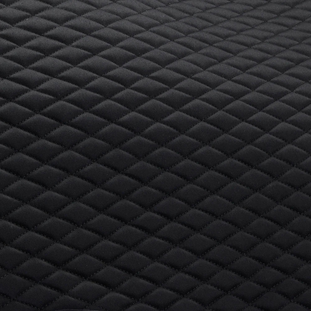 Close-up view of the quilting on the Black Stubben Steamline Adjuster Lambswool Dressage Pad