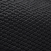 Close-up view of the quilting on the Black Stubben Steamline Adjuster Lambswool Dressage Pad