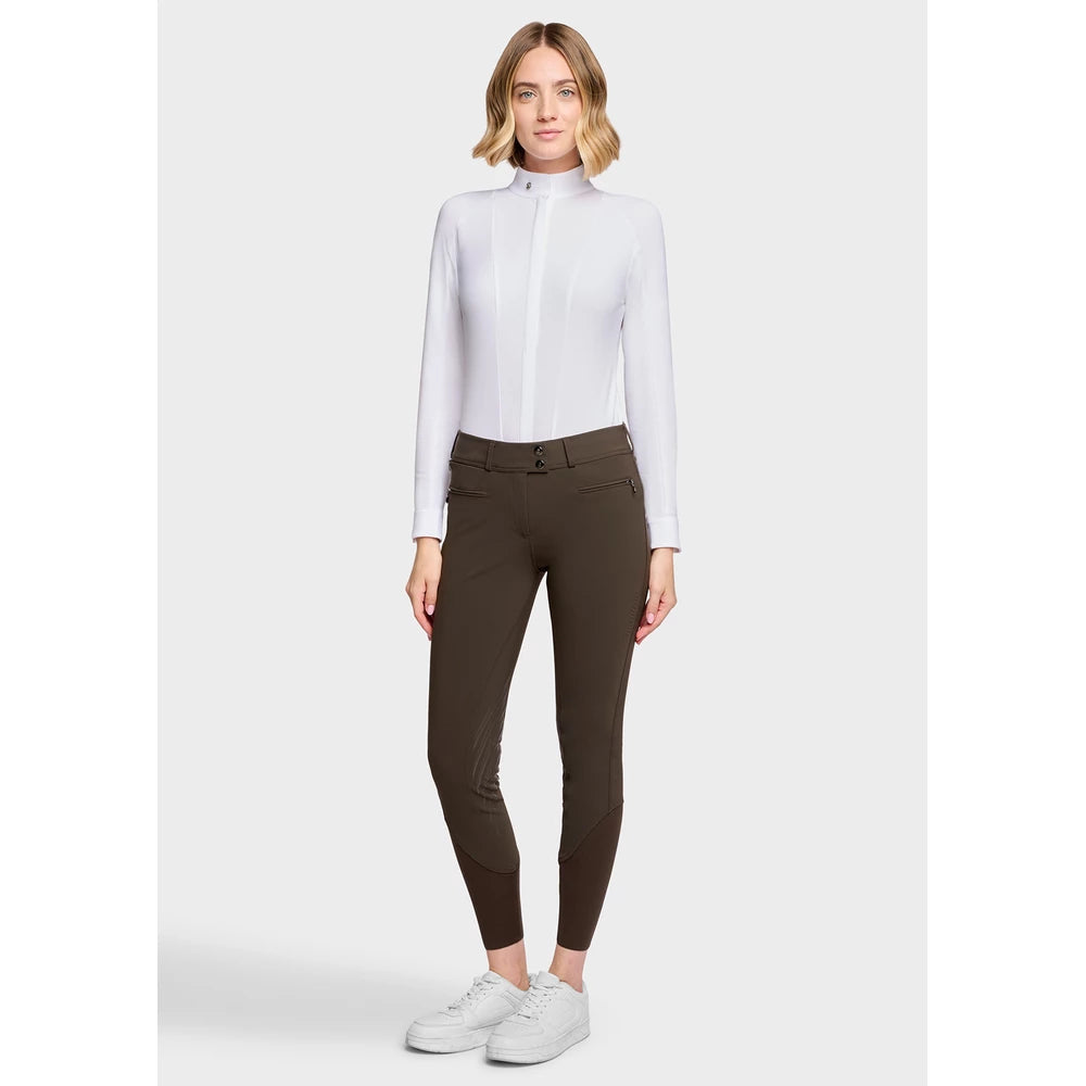 Full body front view of a female model wearing the Mocha Samshield Chloe 3D Full Grip Breeches and white shirt on a plain background