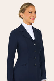 Angled front view of a model wearing the navy RJ Classics Victory Show Coat on a plain background