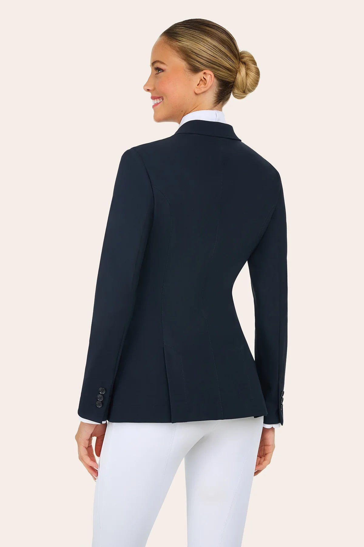Back view of a model wearing the navy RJ Classics Victory Show Coat on a plain background