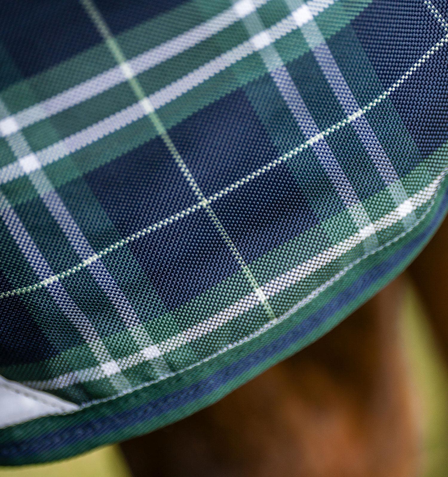 Close-up view of the pattern on the Hunter Check/Green & Navy Horseware Rhino Plus Turnout 0g