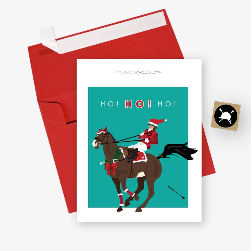 Front view of one of the Ho Ho Ho Hunt Seat Paper Co. Holiday Cards with its envelope