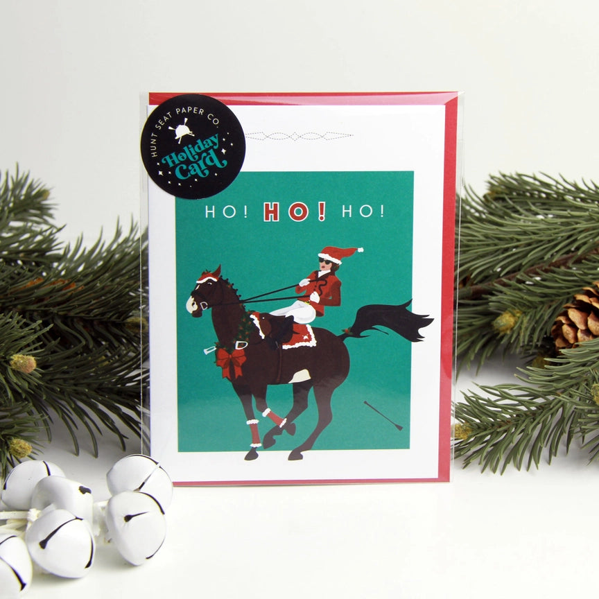 Front view of the Ho Ho Ho Hunt Seat Paper Co. Holiday Card in its packaging