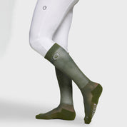 Side view of a model wearing the Dark Forest Samshield Balzane Trio Socks on a plain background
