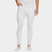 Front view of a male model wearing the White Ariat Men's Tri Factor Knee Patch Breeches on a plain background