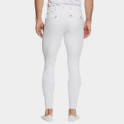 Back view of a male model wearing the White Ariat Men's Tri Factor Knee Patch Breeches on a plain background