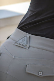 Close-up back view of a female model wearing the Perfect Gray Criniere Juliette High Compression Half Seat Breeches