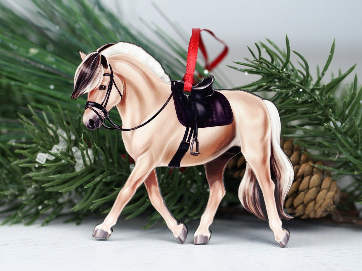 Front view of the Dun Fjord Classy Equine Under Saddle Horse Ornament placed on a table
