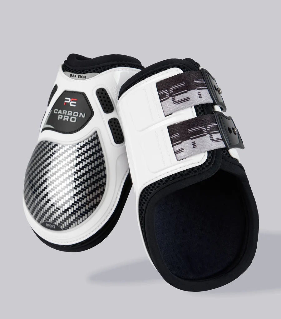 View of a pair of white Premier Equine Carbon Pro Fetlock Boots on a plain background
