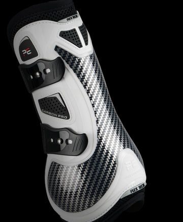 View of a white Premier Equine Carbon Pro Tendon Boot on a black background