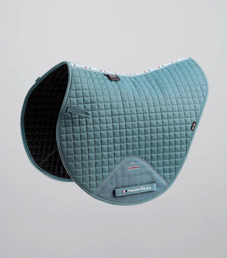 Side view of the Turquoise Premier Equine Close Contact Cotton Cross Country Saddle Pad on a plain background