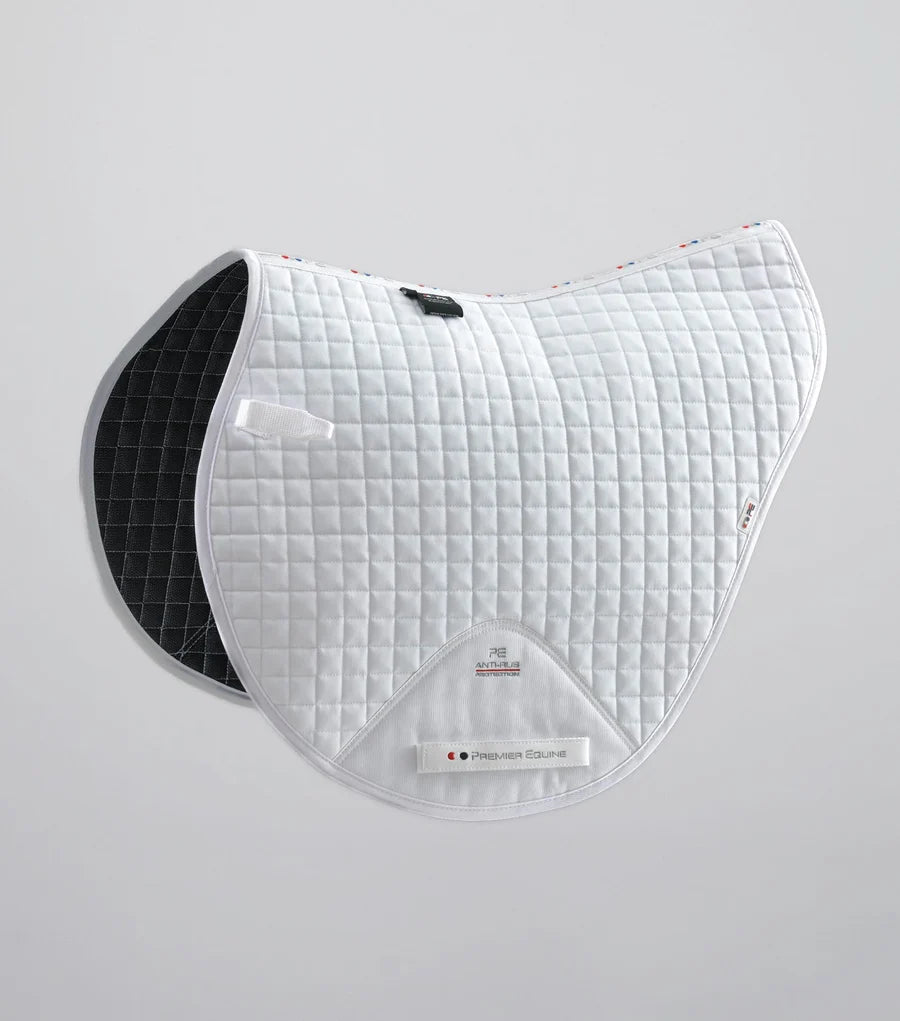 Side view of the White Premier Equine Close Contact Cotton Cross Country Saddle Pad on a plain background
