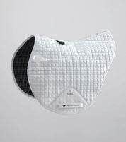 Side view of the White Premier Equine Close Contact Cotton Cross Country Saddle Pad on a plain background