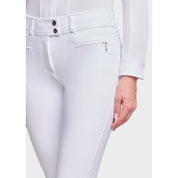 Close-up angled front view of a female model wearing the White Samshield Chloe 3D Full Grip Breeches on a plain background