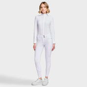 Full body front view of a female model wearing the White Samshield Chloe 3D Full Grip Breeches with a white shirt on a plain background