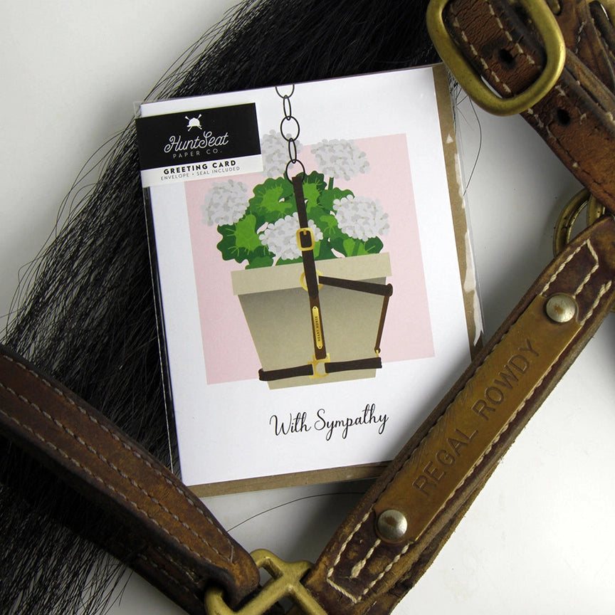 Front view of the With Sympathy Hunt Seat Paper Co. Greeting Card in its packaging