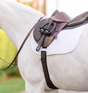 Brown fabric english girth shown on grey horse
