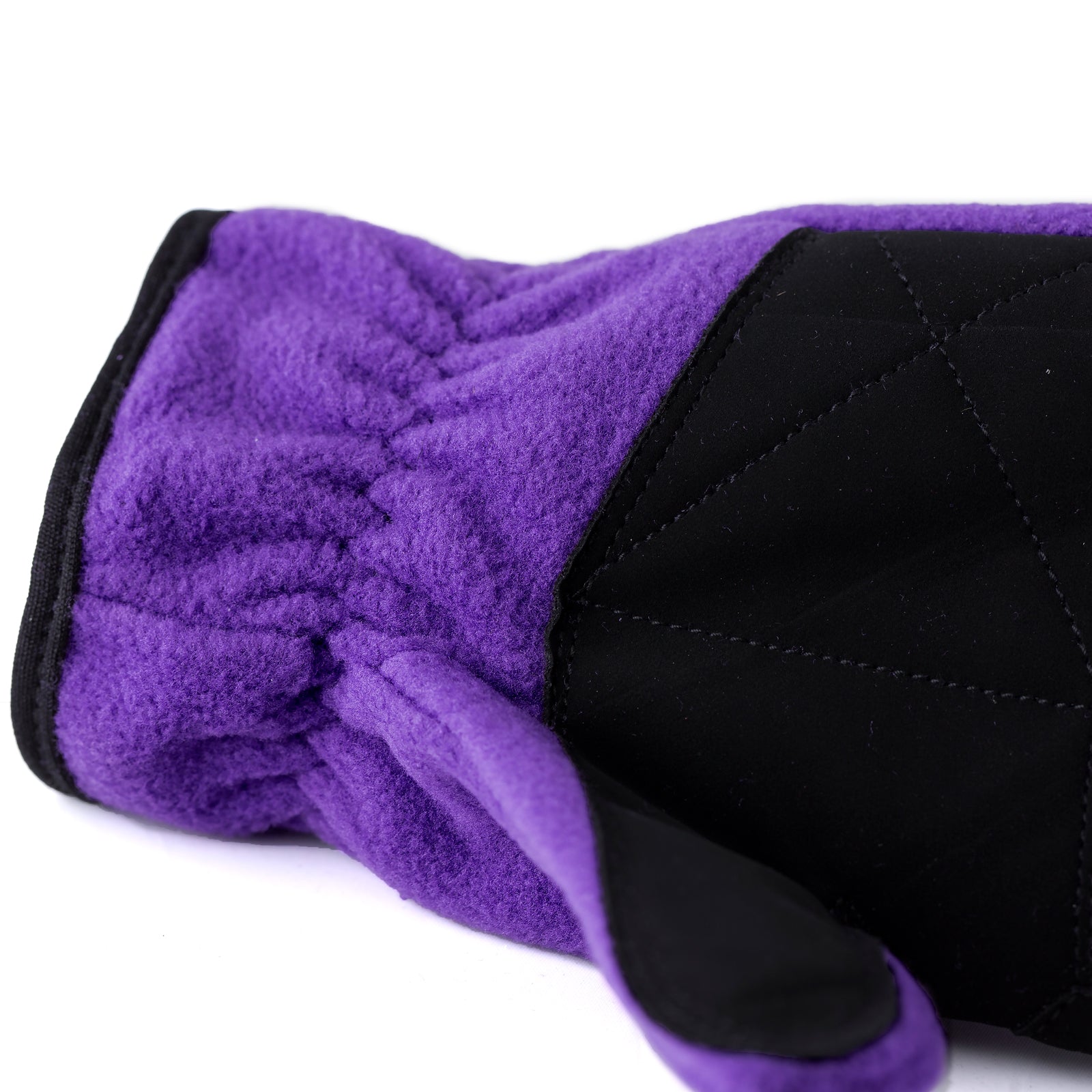 Close-up view of the palm grip on the Violet Horze Kids Fleece Gloves on a white background