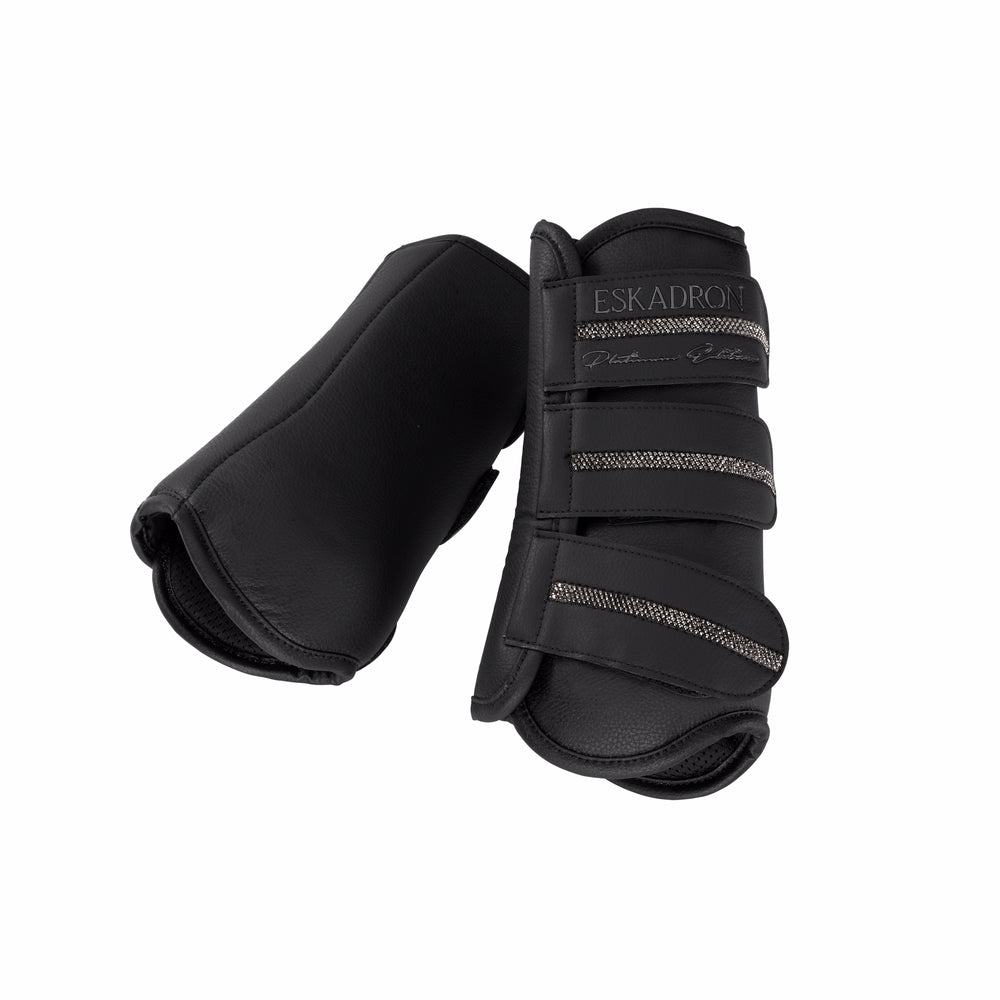 View of a pair of black Eskadron Allround Front Faux Leather Tendon Boots on a white background