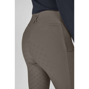 Close-up angled back view of a female model wearing the Eskadron Cosy Full Grip Riding Tights on a plain background