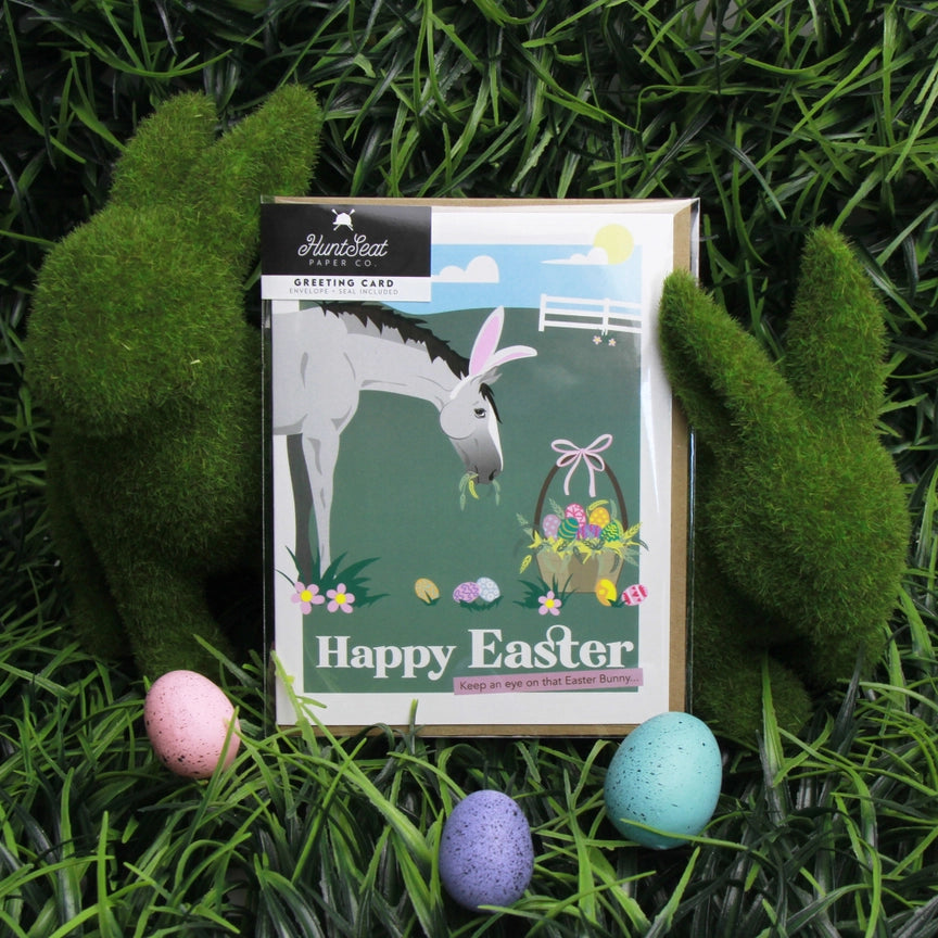 Front view of the Happy Easter Hunt Seat Paper Co. Greeting Card in its packaging