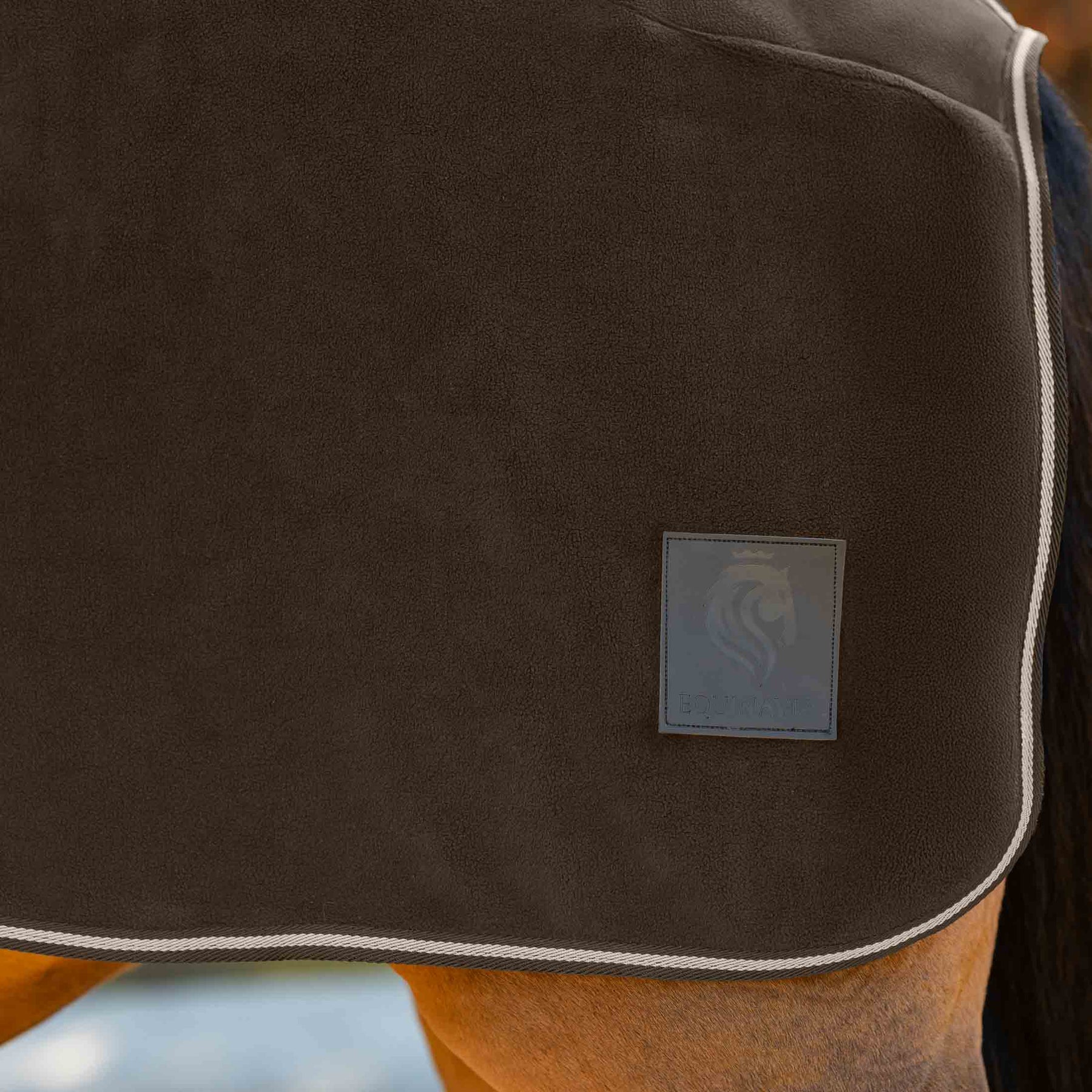 Close-up view of the patch on the Dark Brown Equinavia Norse Fleece Quarter Sheet