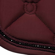 Close-up view of the black rhinestones on the Burgundy Equinavia Bergen Crystal Dressage Saddle Pad