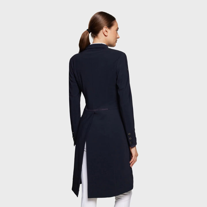 Back view of a female model wearing the Navy Samshield Alcantara Long Frac on a plain background