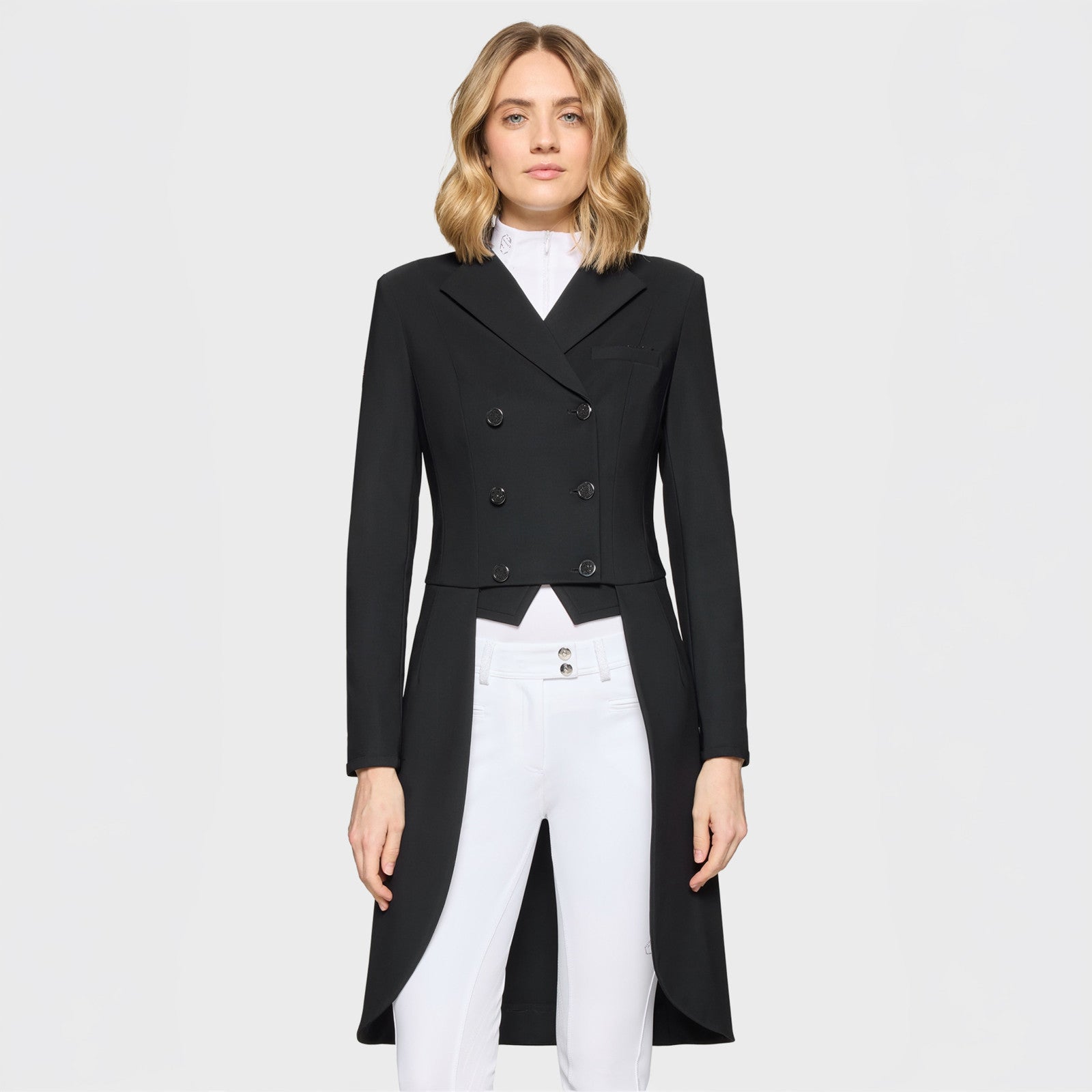 Front view of a female model wearing the black Samshield Frac Crystal Fabric Show Coat on a plain background