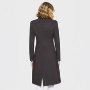 Back view of a female model wearing the Truffle Samshield Frac Crystal Fabric Show Coat on a plain background