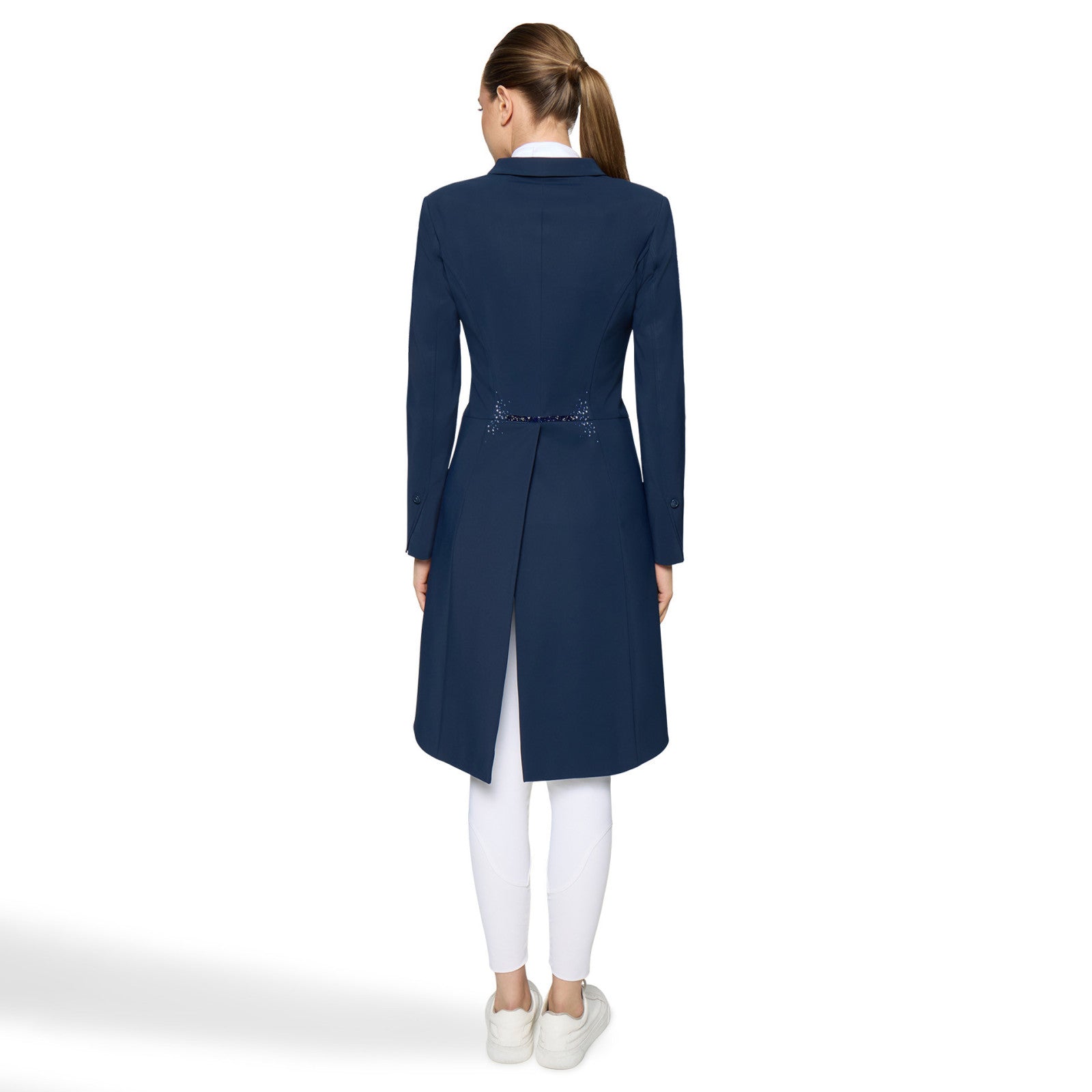 Full body back view of a female model wearing the Cosmic Blue Samshield Premium Frac with white breecheson a plain background