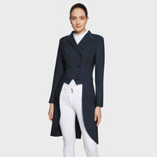 Full body front view of a female model wearing the navy Samshield Premium Frac and white breeches on a plain background