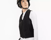 Angled front view of a female model wearing the Freejump Airbag on a white background