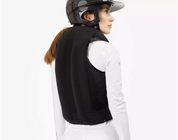 Back view of a female model wearing an inflated Freejump Airbag on a white background