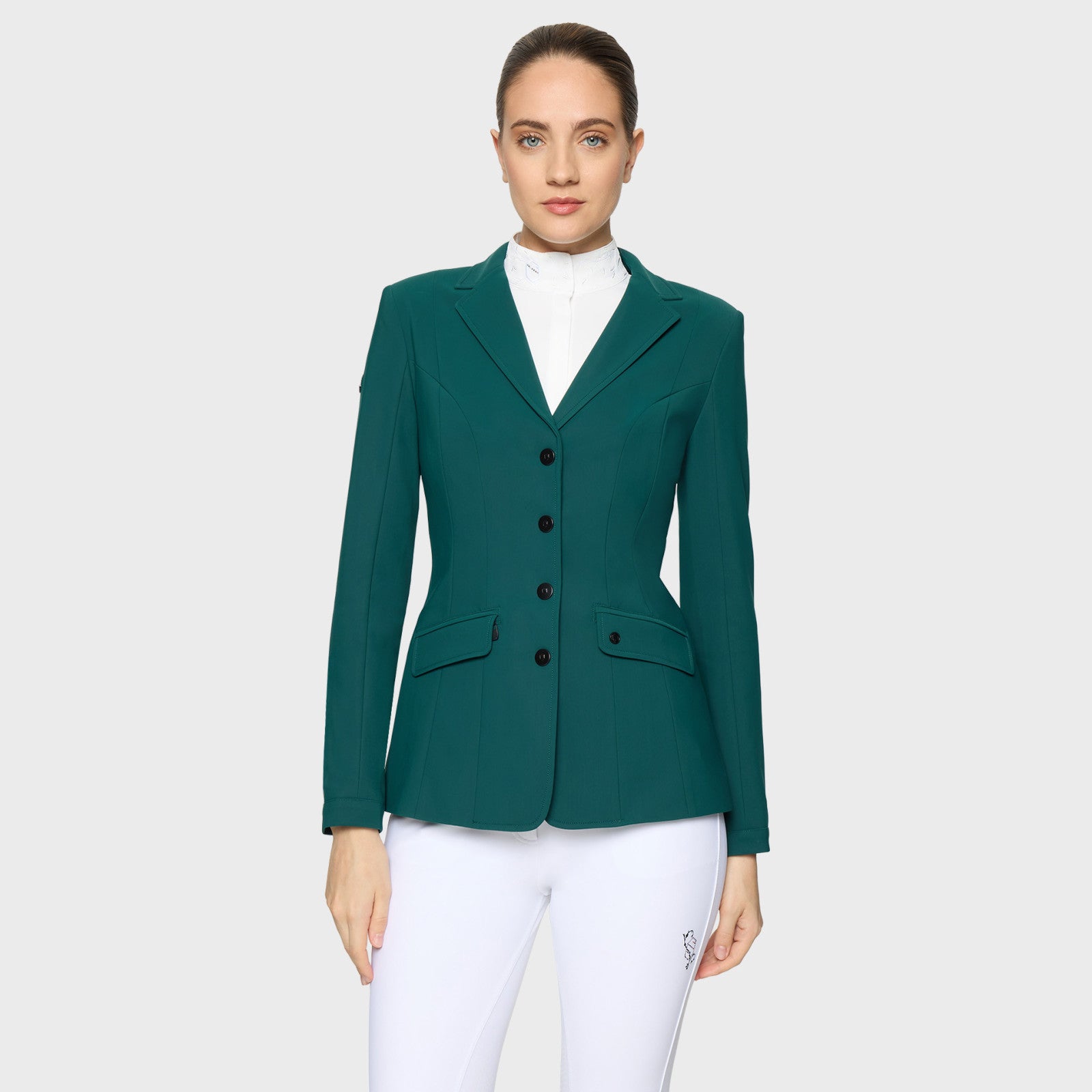 Front view of a female model wearing the Hunter Green Samshield Frida Show Coat on a plain background