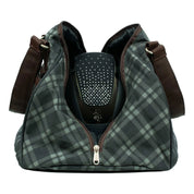 Side view of the Thyme/Lily Pad Equinavia Darby Helmet Bag on a plain background showing the bag unzipped with a helmet inside